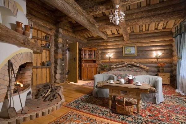 Decorating a log house inside this house is almost unnecessary. In the photo - a log house in a rustic style
