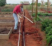 Before starting the installation of the water supply system at the summer cottage, the pipes are laid out in the right places