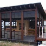 The gazebo turned out to be very attractive from a bar, painted with dark and milky polycarbonate. The roof of this version is made of soft tiles.