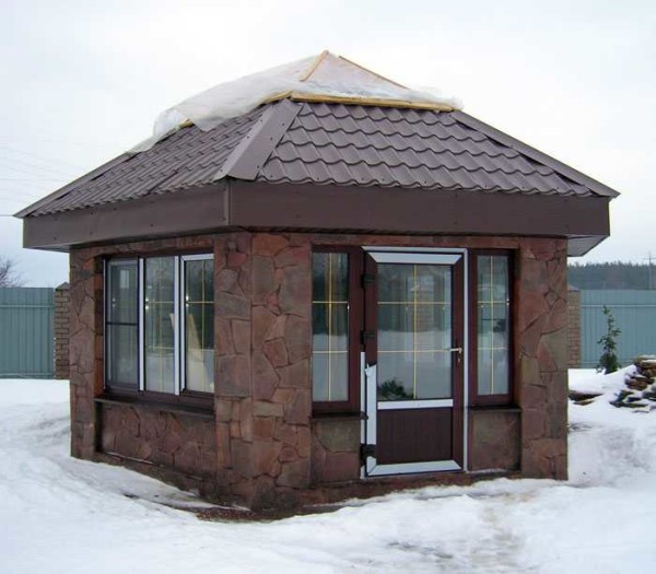 An example of a capital glazed gazebo trimmed with wild stone. Any building block can be at the bottom. Glazed with double-glazed windows