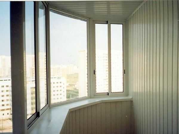 In the photo, a balcony sheathed with plastic - plastic clapboard