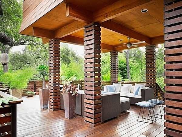 The whole highlight of this country house veranda interior is in the unusual design of the columns