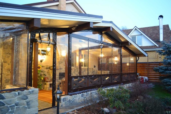 Protective curtains made of transparent PVC foil. Stretched like an awning: tied to the racks through special sockets