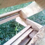 For the convenience of fastening the rafter legs, a 50 * 50 mm bar was nailed along the edge of the floor beams. A gash was made in the rafters under it. During installation, they first simply rested against the bar, then they were attached