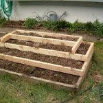 Multi-tiered flowerbed-pyramid made of boards