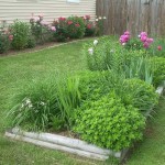 Two pieces of a block house, installed one on top of the other - and in front of you is already an excellent summer cottage flower bed