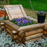 An interesting idea for a high flower bed - a well is made of scraps of logs