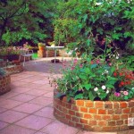 When building a round border for a brick flower bed, it is more economical to use halves