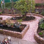 Ceramic bricks of different colors and paths sprinkled with tinted gravel and a courtyard with a flower bed looks great