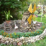This is a curb for a cobblestone bed. The technique used is different - a roller is formed from a semi-dry solution, small stones are stuck into it