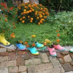 Small old, leaky rubber boots with flowers planted in them will also be a wonderful decoration for a garden or yard.