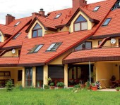 A mansard roof in several levels is also a common technique.