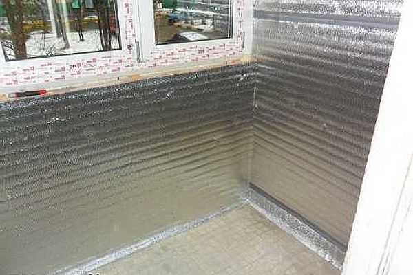Foil-clad polyethylene is nailed on top of the insulation to reduce heat loss and prevent steam from entering the insulation