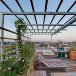 Another combination of wood and metal, but the design is different, a different feeling. Such a pergola can be arranged on an open balcony