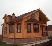 This house is finished with log siding (acrylic or vinyl - unknown)