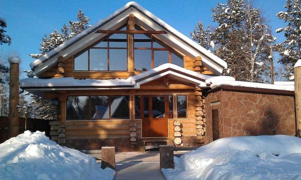 Glazing of the veranda in the country from a log