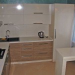 The floor and finish of the kitchen cabinets are made in the same color. The border is kind of blurred