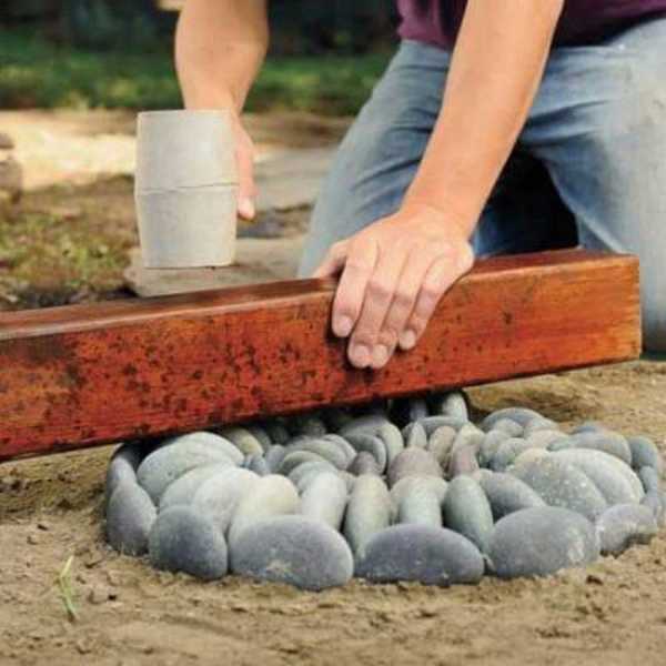 The stones are sunk into the sand