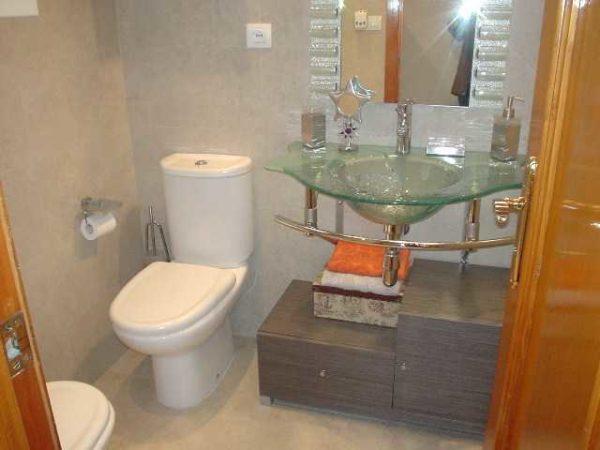 The glass sink does not clutter up the space. Even a small bathroom looks spacious
