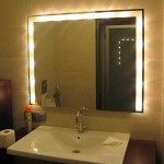 By hiding the lamps behind the mirror, they achieve an interesting effect.