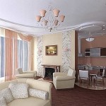 The floor is on one level, but the kitchen area is tiled, the living area is covered with laminate. The non-linear shape of the ceiling protrusion is repeated in the floor design
