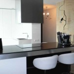 The idea of ​​zoning the kitchen and living room with a functional table