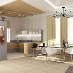 Adjacent kitchen with living room lit differently