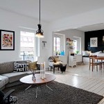 The kitchen combined with the hall is illuminated by separate lamps, similar in style