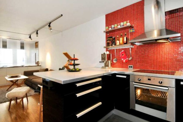 In this case, the divider is the table on which it is fashionable to cook and dine
