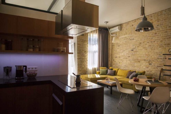 Creatively - part of the brick wall remains untreated. Combined with smooth glossy surfaces, it looks very lively