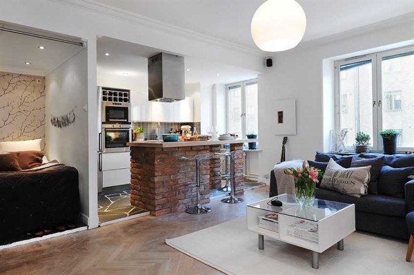 A studio apartment is characterized by the absence of walls and doors (except for those that fence off the bathroom)