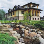 Using the slope to create a stream and waterfalls is a classic technique that does not lose its relevance