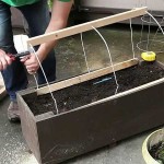 Another design of a small greenhouse on the balcony from arcs