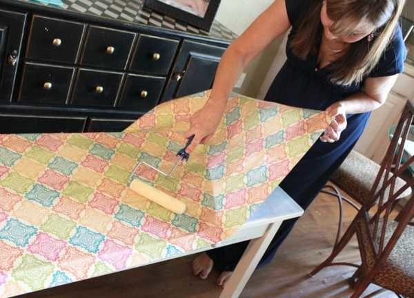 The paper is glued gradually, roll it with a roller so that there are no bubbles