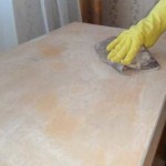 After the varnish was removed (the grinder helped to cope faster), they covered it with a layer of putty, repairing chips and cracks, then sanded to smoothness