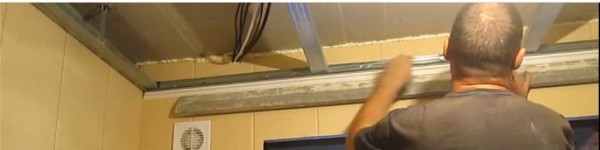 Installation of a starter profile for plastic panels