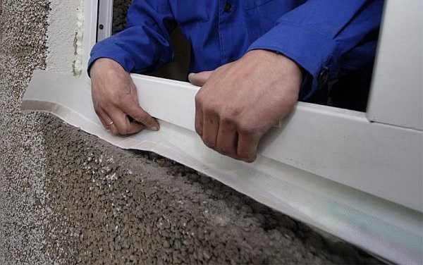 Installation of waterproofing tape under the ebb of a plastic window