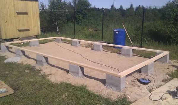 After the blocks are laid out, the lower strapping is attached to them