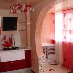 Successful repetition of the pattern on the curtains and the shape of the chandelier