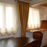 How to decorate two windows in the kitchen with curtains next to each other