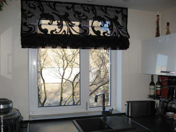 A translucent Roman blind to match the countertop will only look in a very bright kitchen