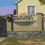 This combination fence has a flagstone plinth, brick pillars to which concrete decorative slabs are attached