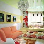 Cheerful and cheerful design of a one-room apartment - plain walls and a light floor, and accents - a partition of vertical blinds and textiles
