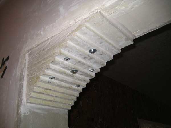 The arch is assembled from plates cut from drywall
