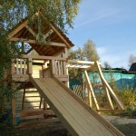 Wooden slide - only part of the play corner for children in the country