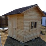 Wooden house for children, lined with clapboard