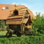 A house, like from a fairy tale - carved, on a hemp