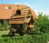 A house, like from a fairy tale - carved, on a hemp
