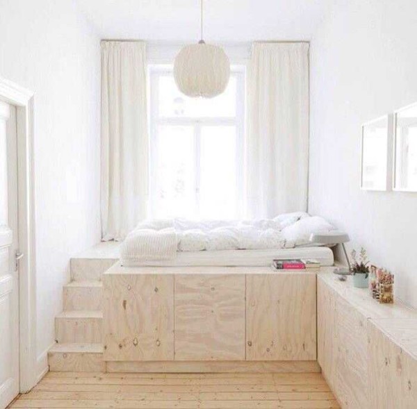 An interesting option for small areas: a sleeping place on a high podium, which is used as a wardrobe. This is the real interior in Khrushchev