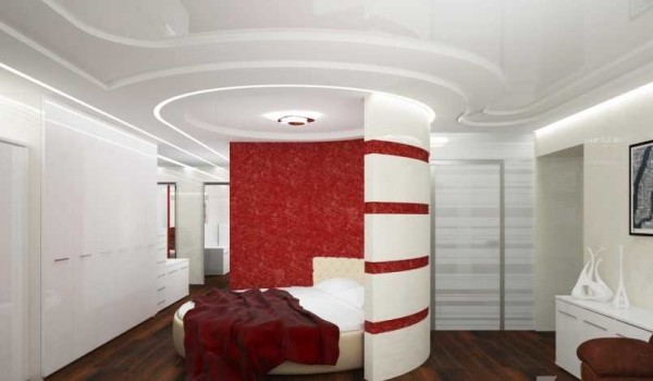 The bedroom in this two-room apartment is almost not isolated - it is separated from the living room only by a semicircular